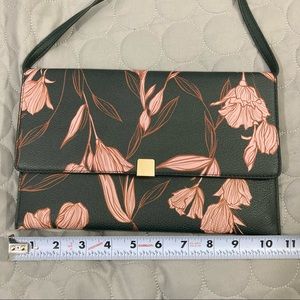 Sleek like new floral handbag black and pink thin profile long strap bag purse